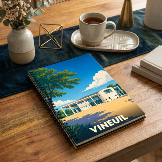 Carnet à spirales souvenir de la ville de Vineuil avec une illustration stylisée et colorée.