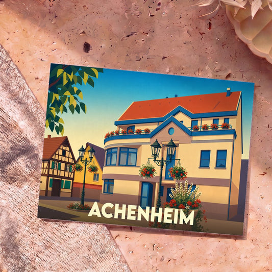 Carte postale souvenir de la ville d'Achenheim avec une illustration stylisée de maisons à colombages et de bâtiments fleuris.
