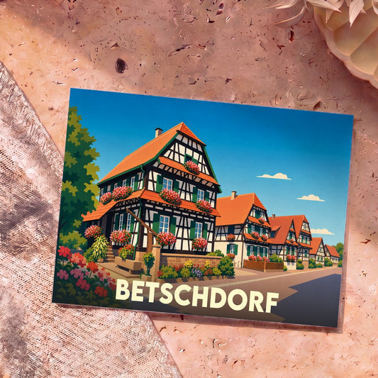 Carte postale souvenir de la ville de Betschdorf illustrant ses maisons à colombages traditionnelles.