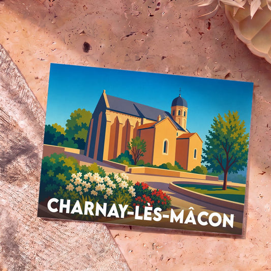 Carte postale souvenir de Charnay-lès-Mâcon représentant une église avec une illustration colorée et stylisée.