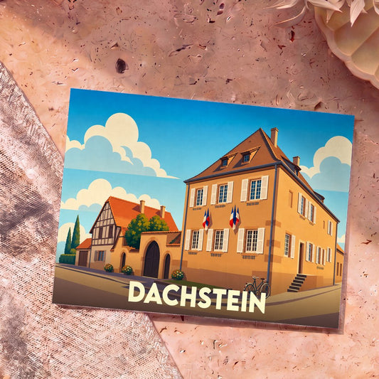 Carte postale souvenir de la ville de Dachstein illustrant des bâtiments traditionnels alsaciens sous un ciel azur.