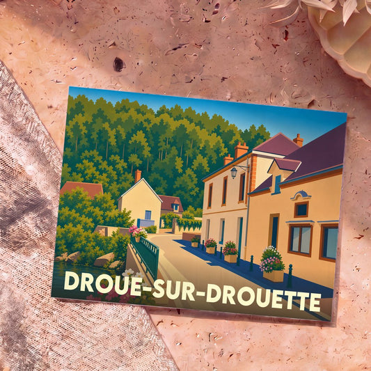 Carte postale souvenir de la ville de Droue-sur-Drouette avec une illustration colorée et stylisée de ses rues et de ses paysages.