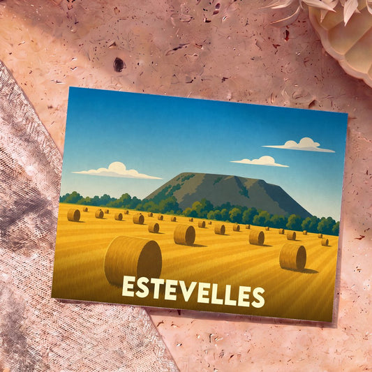 Carte postale souvenir de la ville d'Estevelles illustrant un champ de ballots de paille devant un terril.