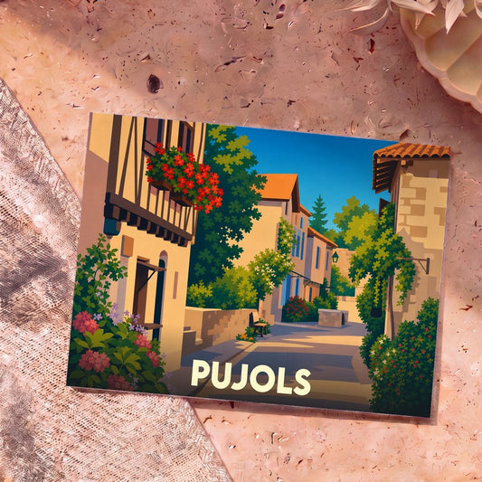 Carte postale souvenir de la ville de Pujols avec une illustration colorée et stylisée d'une ruelle ensoleillée.