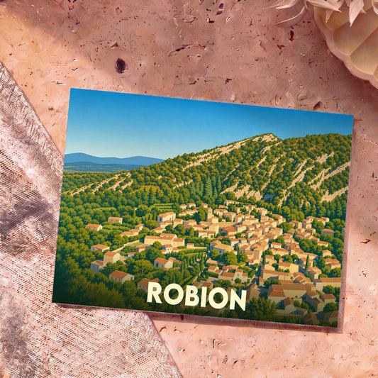 Carte postale souvenir de la ville de Robion avec une illustration stylisée d'un village provençal au pied d'une colline verdoyante.