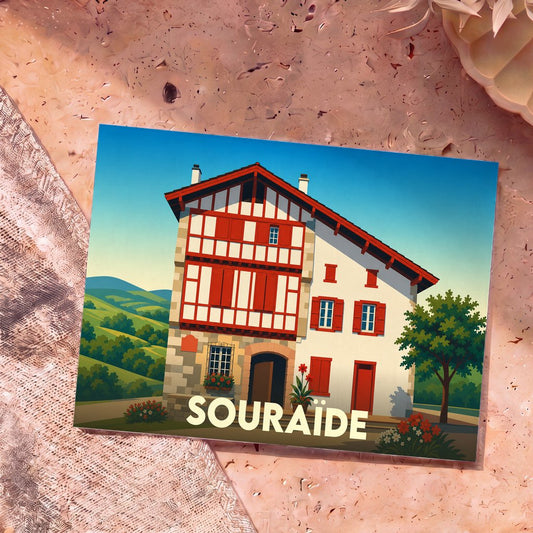 Carte postale souvenir de la ville de Souraïde représentant une maison basque traditionnelle en illustration stylisée.