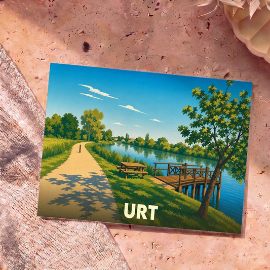 Carte postale souvenir de la ville de Urt avec une illustration stylisée d'un bord de rivière paisible.