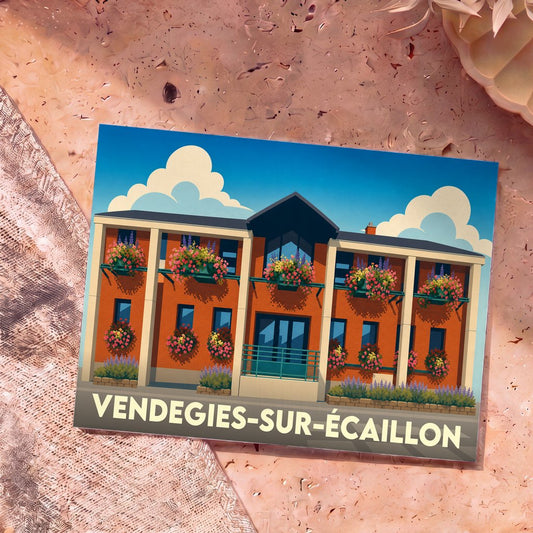 Carte postale souvenir de la ville de Vendegies-sur-Écaillon avec une illustration stylisée de la mairie fleurie.