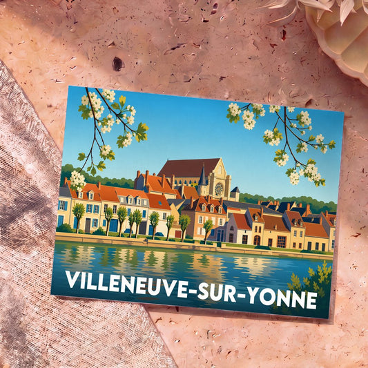 Carte postale souvenir de Villeneuve-sur-Yonne illustrant les bords de l'Yonne avec son architecture typique et son église.