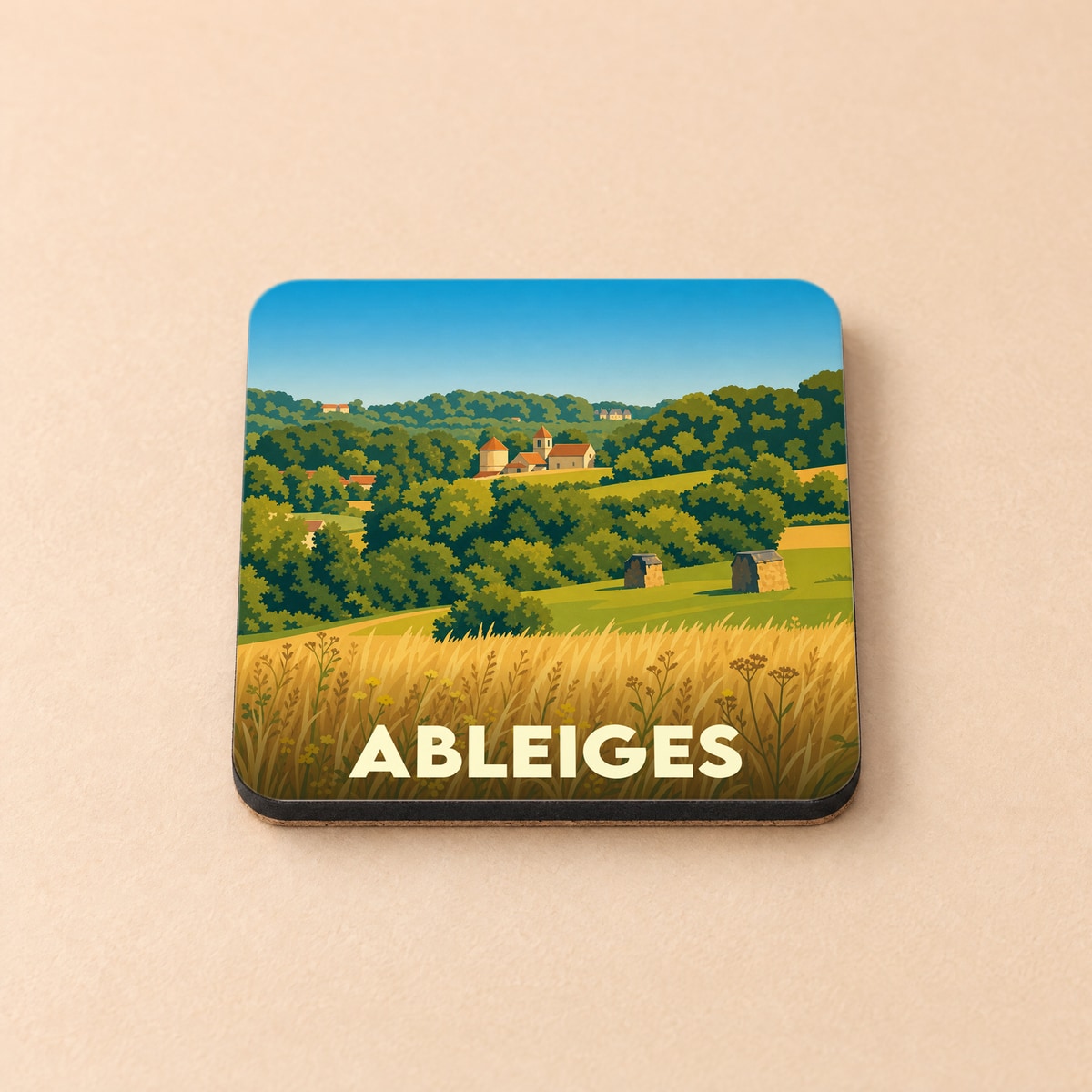Dessous de verre souvenir de la ville de Ableiges avec une illustration de paysage rural stylisée.