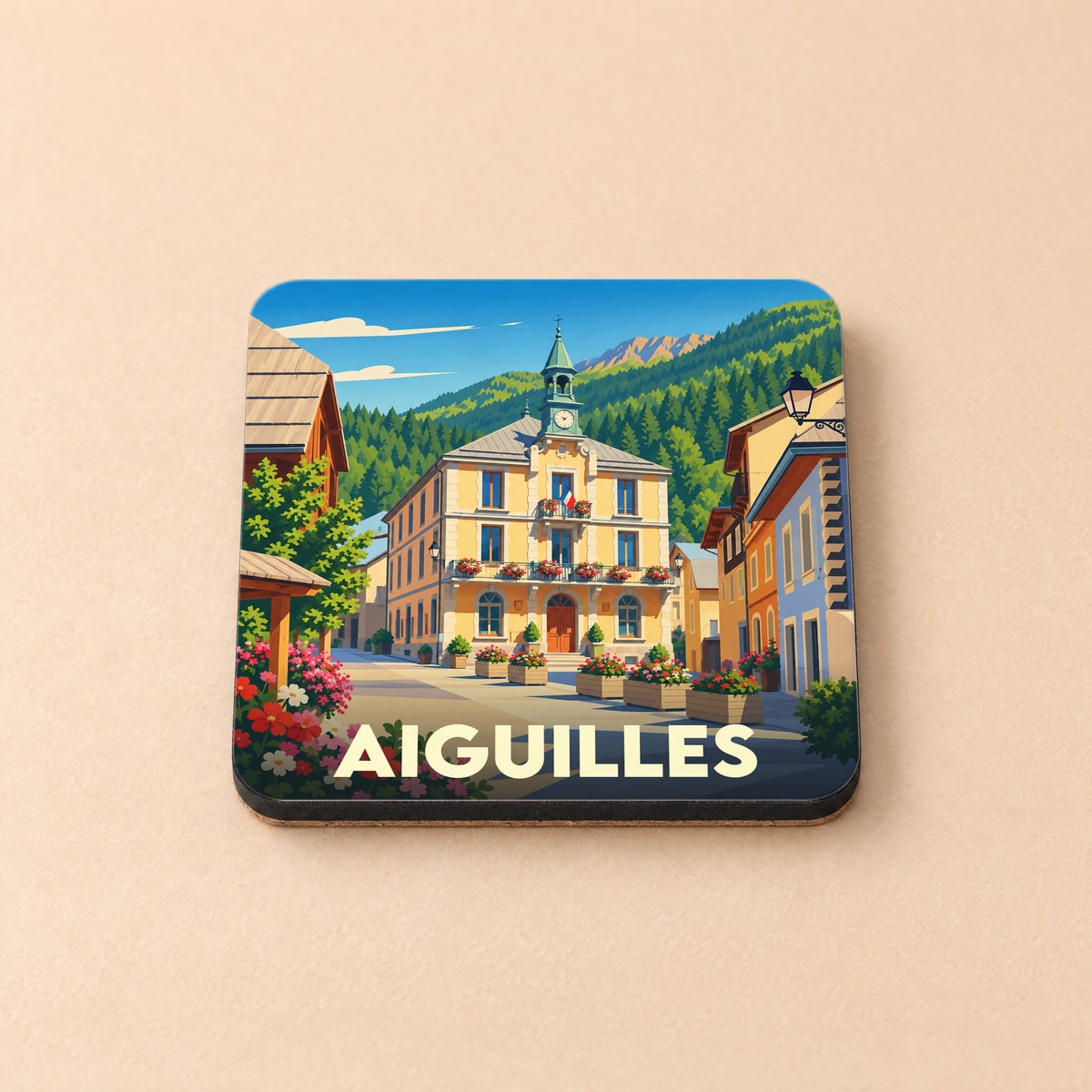 Dessous de verre souvenir de la ville d'Aiguilles avec une illustration stylisée de sa mairie de montagne.