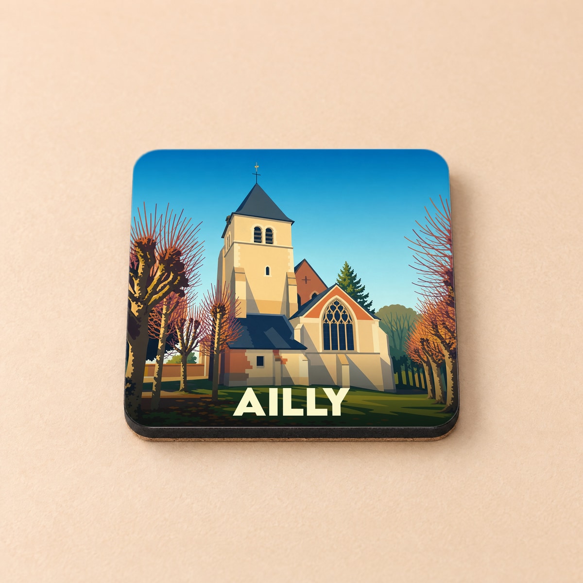 Dessous de verre souvenir de la ville d'Ailly avec une illustration stylisée de son église.