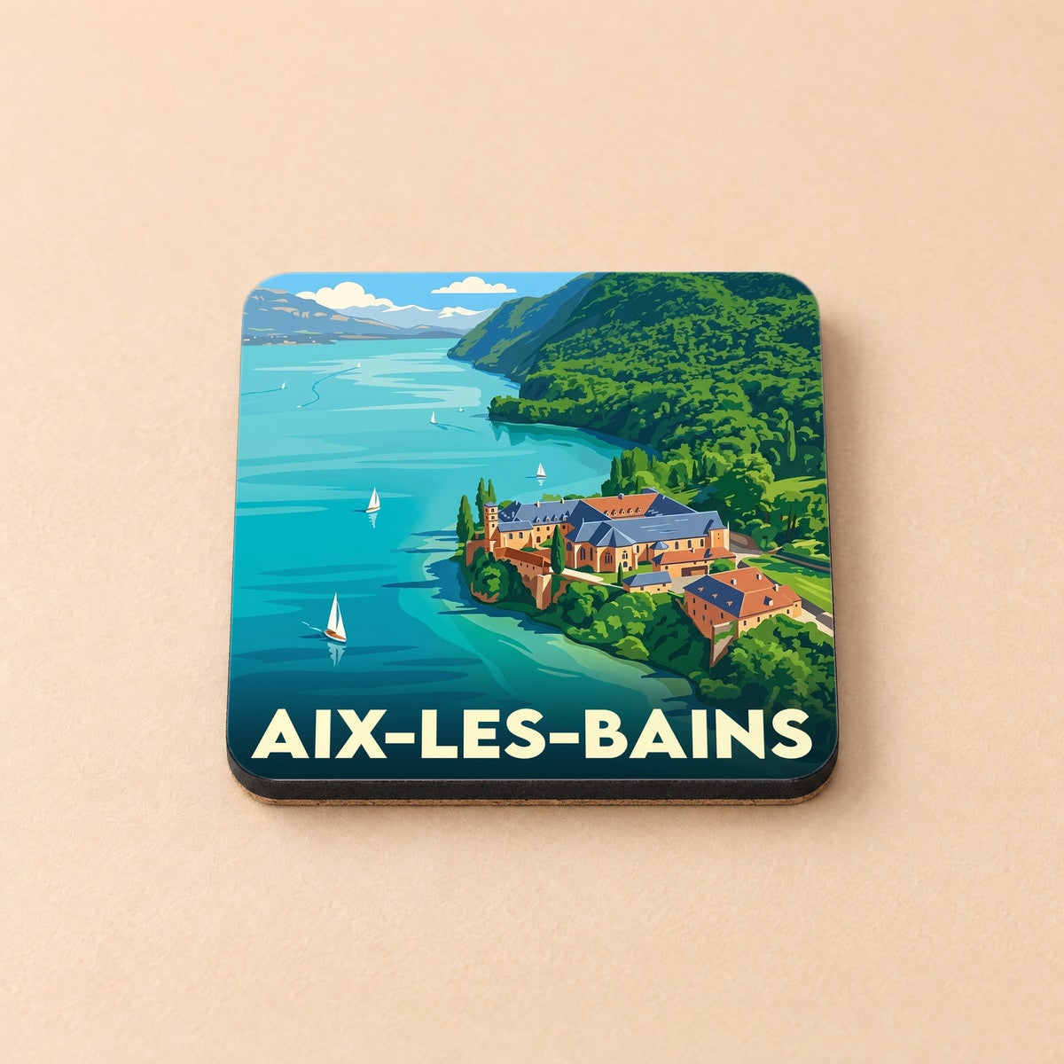 Dessous de verre souvenir de la ville d'Aix-les-Bains avec une illustration stylisée du lac du Bourget et de l'abbaye d'Hautecombe.