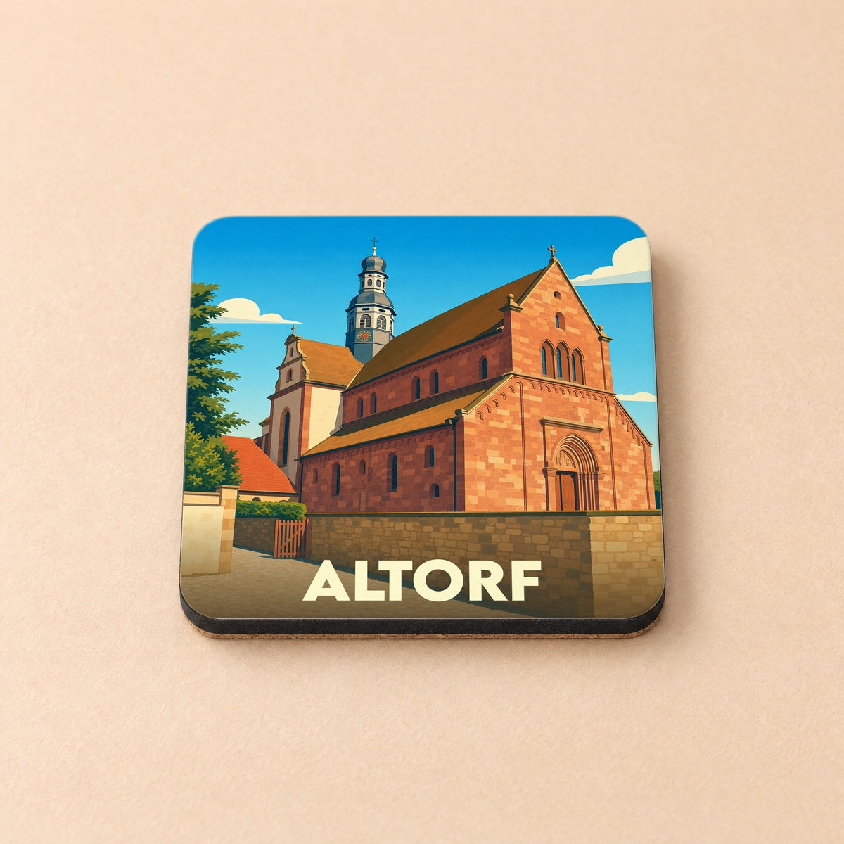 Dessous de verre souvenir de la ville d'Altorf avec une illustration stylisée de son abbaye.