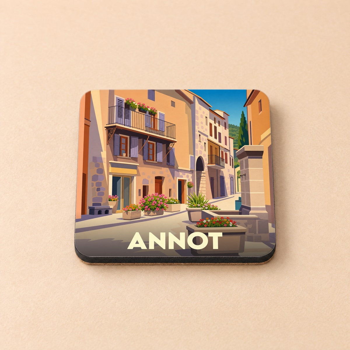 Dessous de verre souvenir de la ville d'Annot avec une illustration stylisée d'une ruelle fleurie.