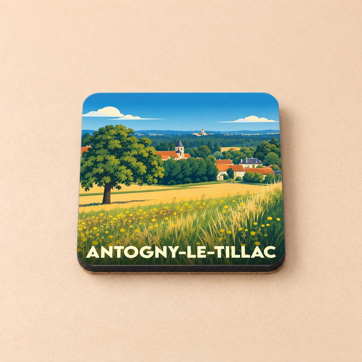 Dessous de verre souvenir de la ville d'Antogny-le-Tillac avec une illustration champêtre stylisée.