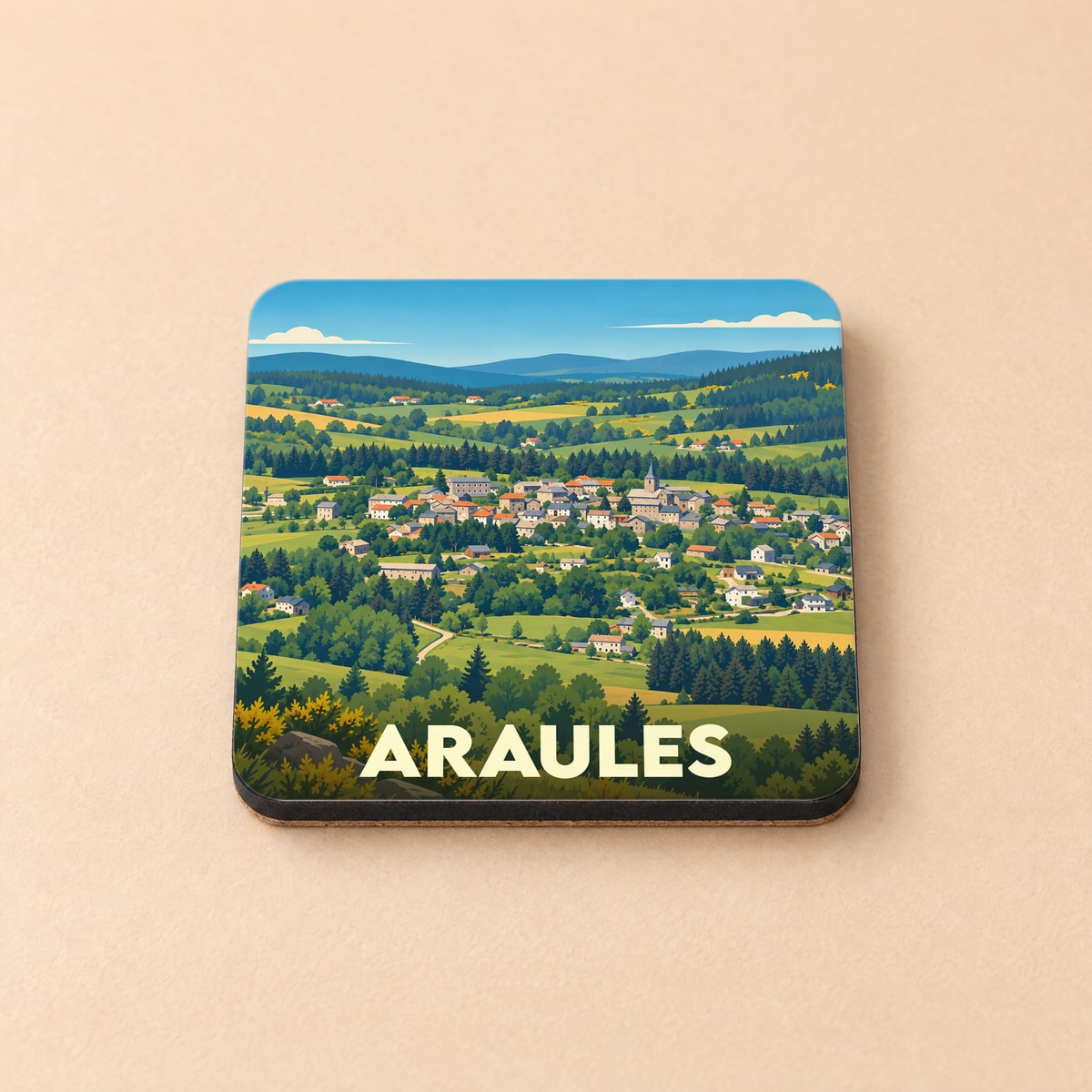 Dessous de verre souvenir de la ville de Araules avec une illustration stylisée de son paysage vallonné.