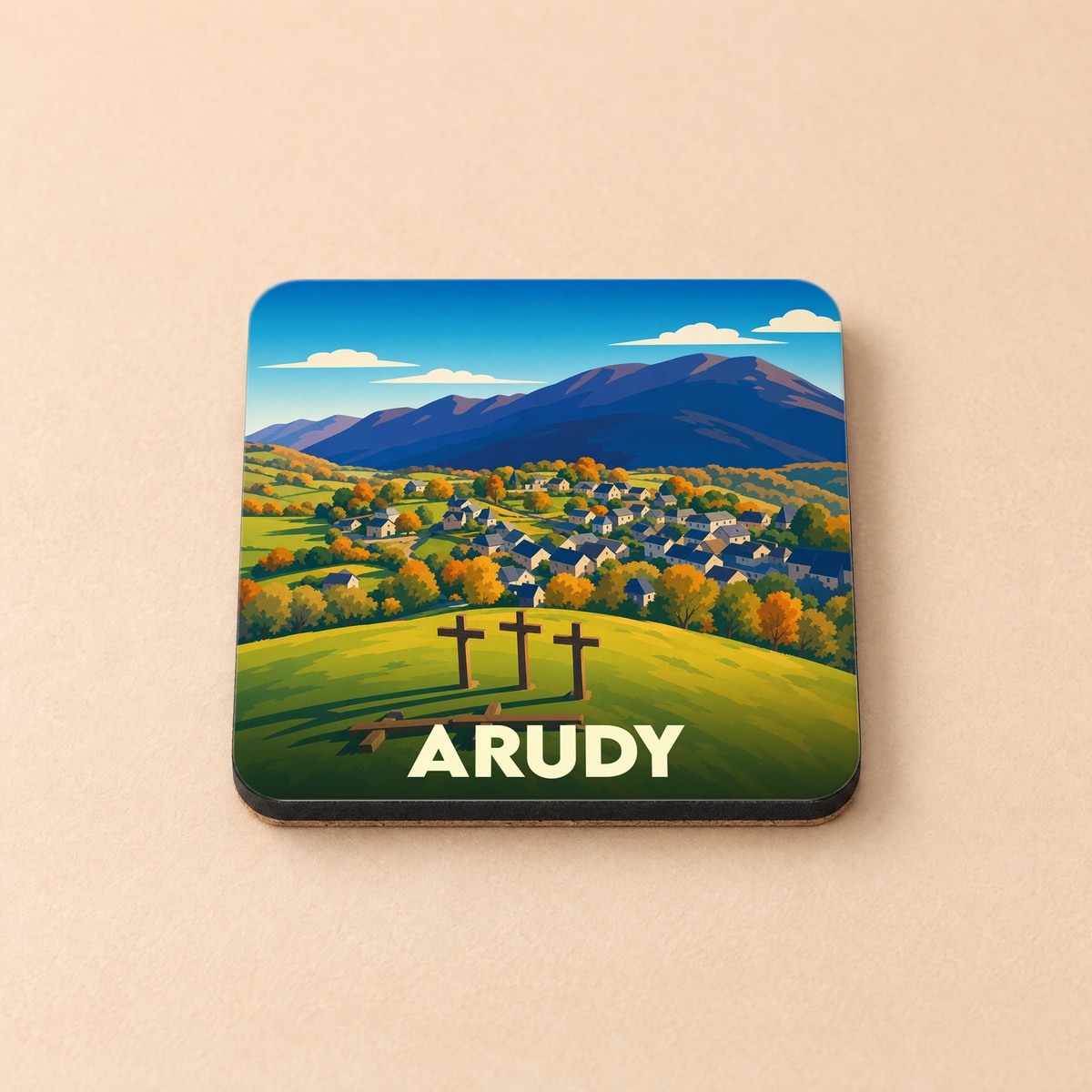 Dessous de verre souvenir de la ville d'Arudy illustré d'un paysage montagneux stylisé.