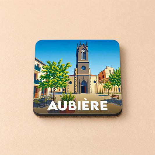 Dessous de verre souvenir de la ville d'Aubière avec une illustration stylisée de sa place centrale et de son église.