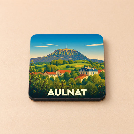 Dessous de verre souvenir de la ville d'Aulnat avec une illustration stylisée d'un paysage de montagne.