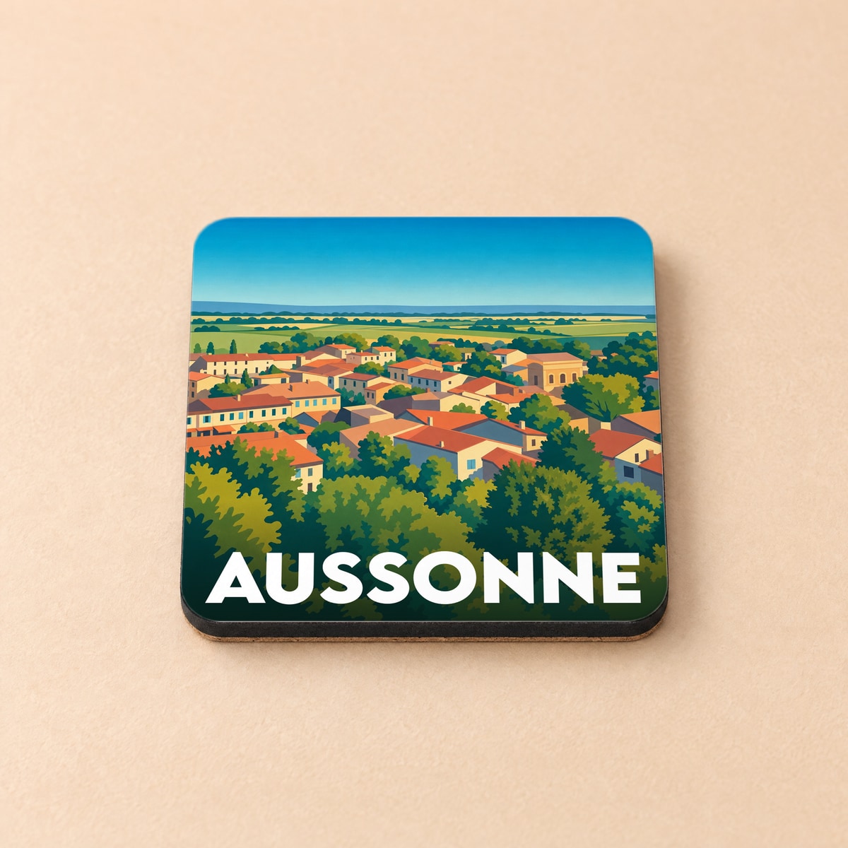 Dessous de verre souvenir de la ville d'Aussonne avec une illustration stylisée de ses toits.