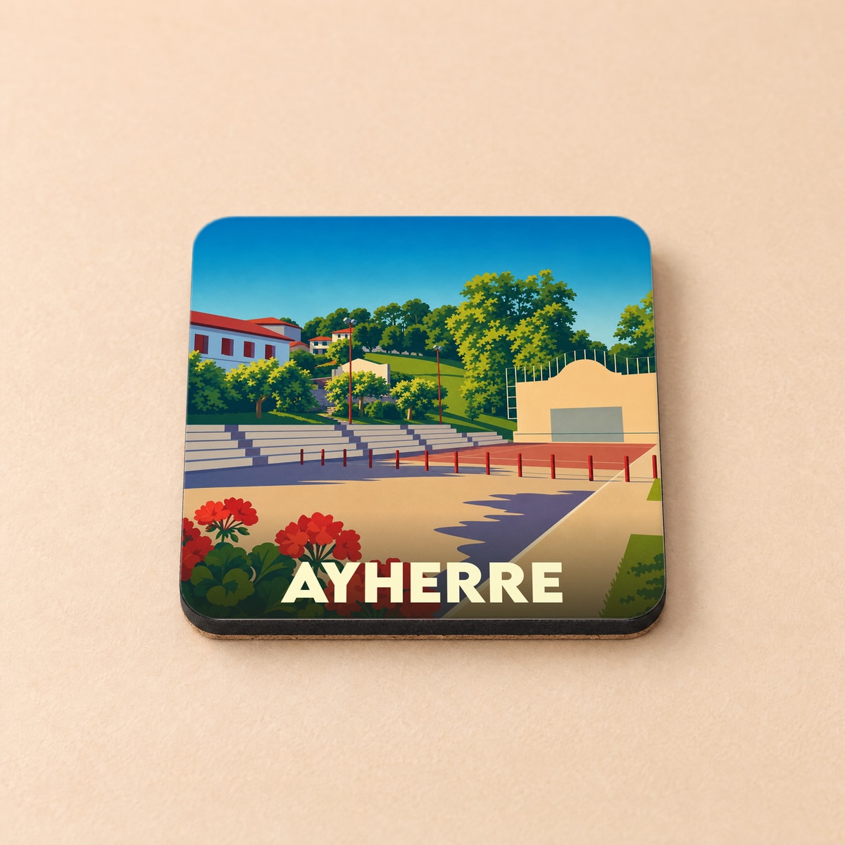 Dessous de verre souvenir de la ville de Ayherre avec une illustration stylisée de son fronton.
