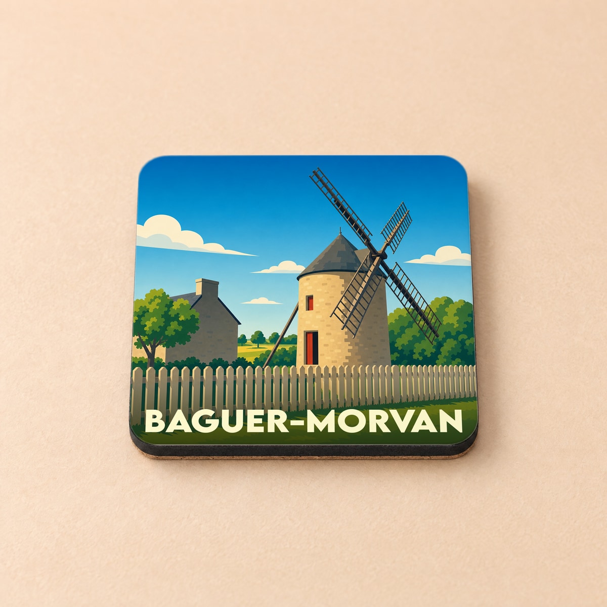 Dessous de verre souvenir de la ville de Baguer-Morvan avec une illustration stylisée d'un moulin à vent.