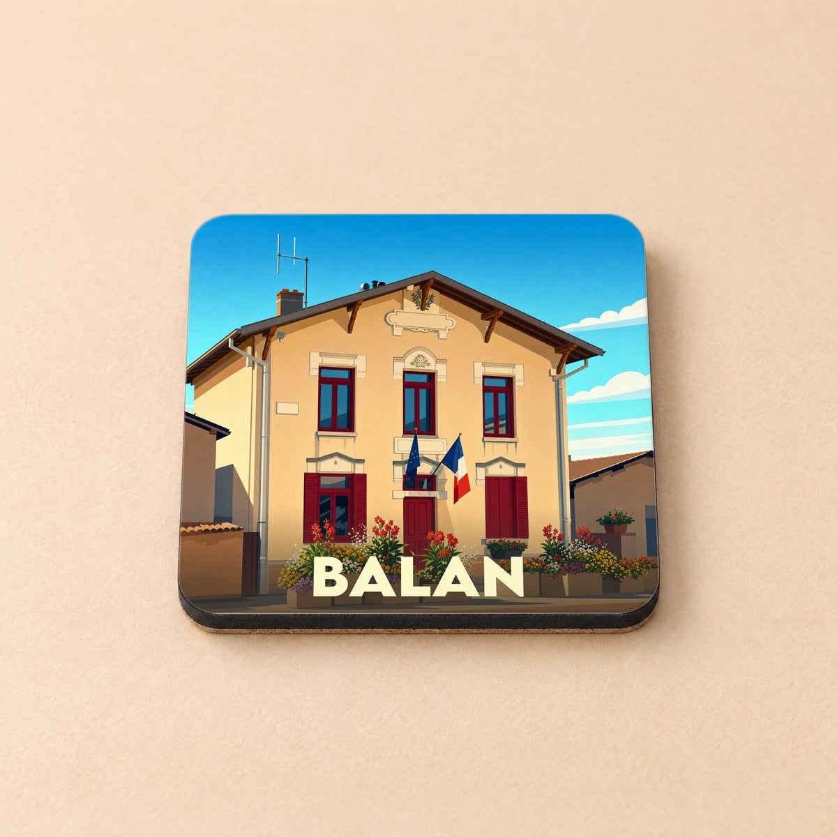 Dessous de verre souvenir de la ville de Balan avec une illustration stylisée de sa mairie.
