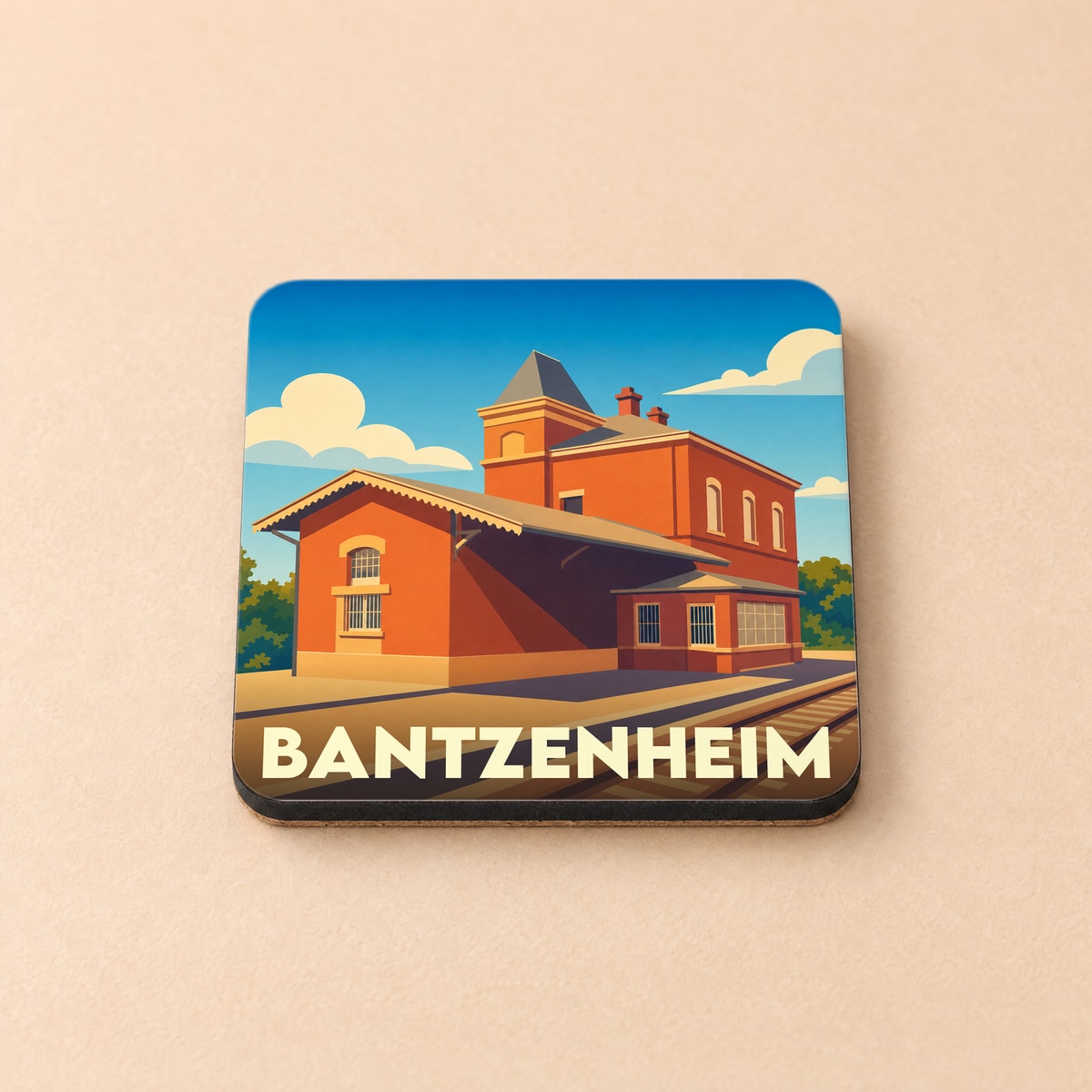 Dessous de verre souvenir de la ville de Bantzenheim avec une illustration stylisée de sa gare.