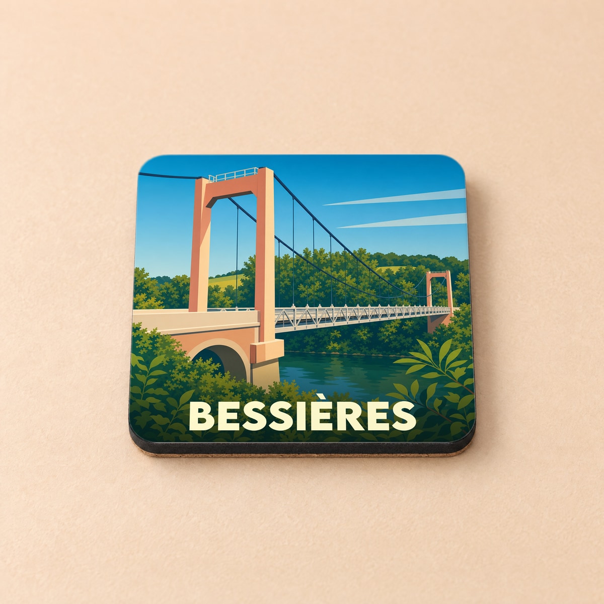 Dessous de verre souvenir de la ville de Bessières avec une illustration stylisée de son pont suspendu.