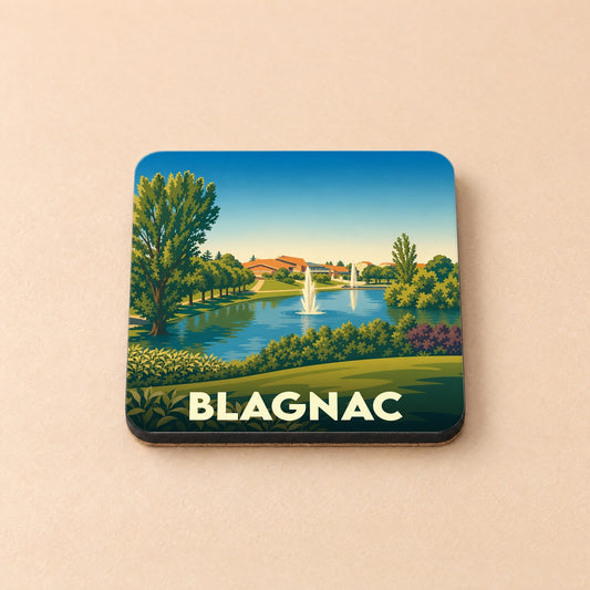 Dessous de verre souvenir de la ville de Blagnac avec une illustration stylisée de parc et jet d'eau.