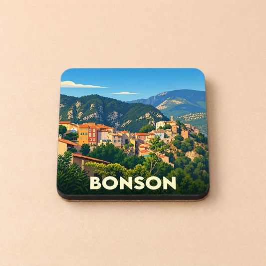 Dessous de verre souvenir de la ville de Bonson avec une illustration stylisée de son village perché dans les montagnes.