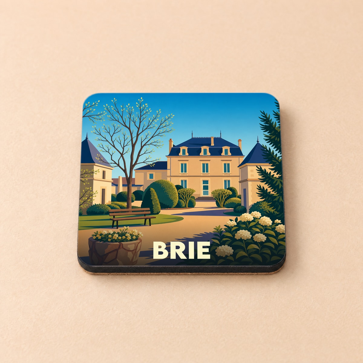 Dessous de verre souvenir de la ville de Brie avec une illustration stylisée d'un domaine arboré.