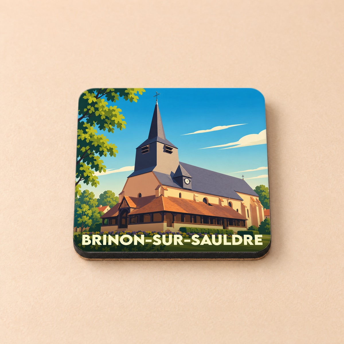 Dessous de verre souvenir de la ville de Brinon-sur-Sauldre avec une illustration stylisée de son église historique.