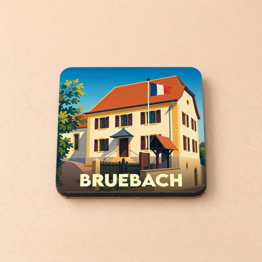 Dessous de verre souvenir de la ville de Bruebach avec une illustration stylisée d'un bâtiment arborant le drapeau français.