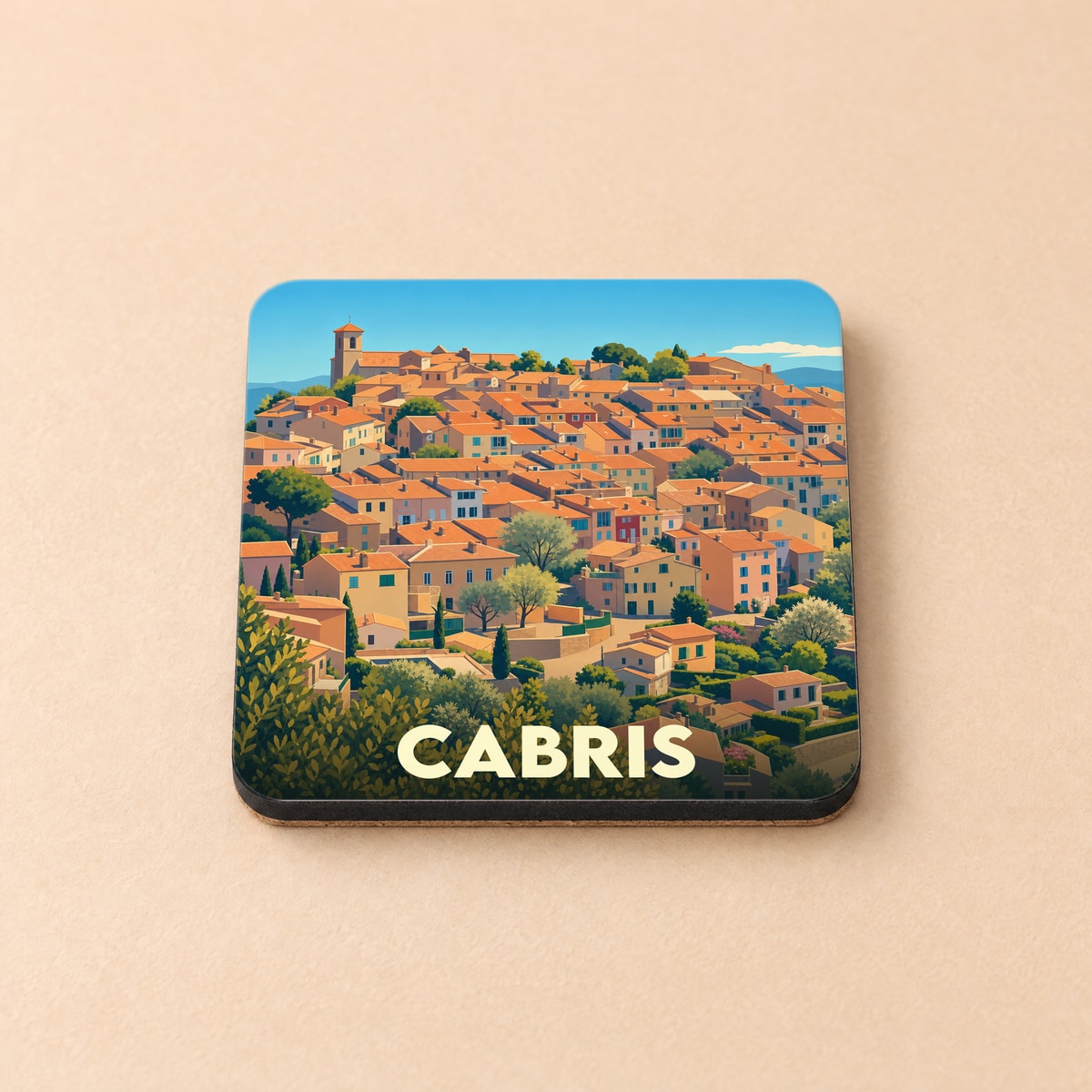 Dessous de verre souvenir de la ville de Cabris avec une illustration stylisée de ses maisons provençales.