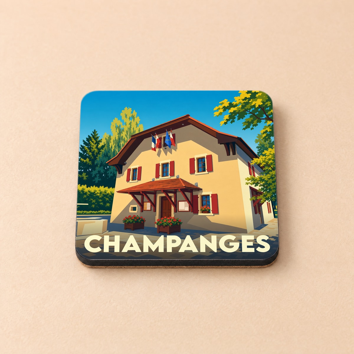 Dessous de verre souvenir de la ville de Champanges avec une illustration stylisée de sa mairie.