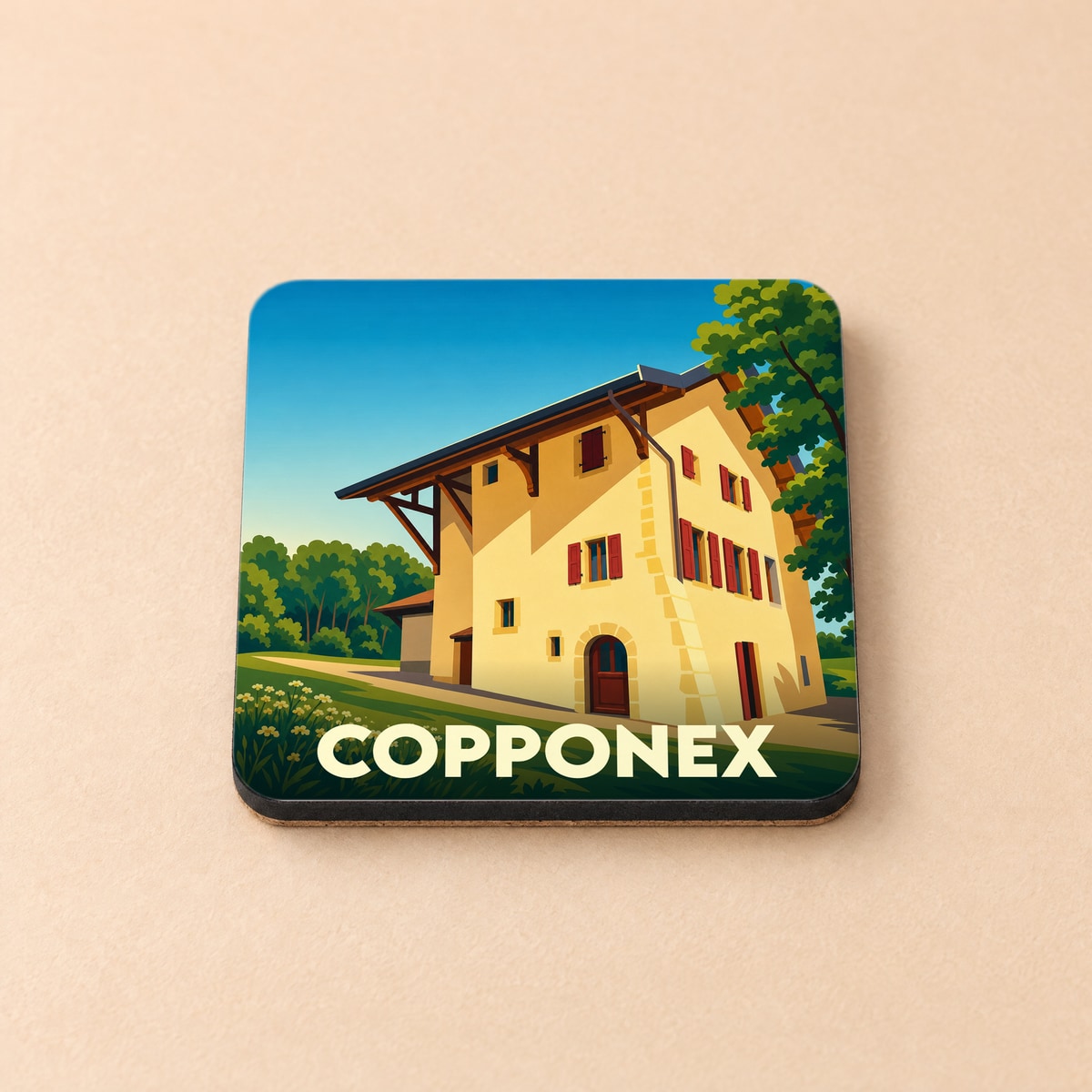 Dessous de verre souvenir de la ville de Copponex avec une illustration stylisée d'une maison traditionnelle.