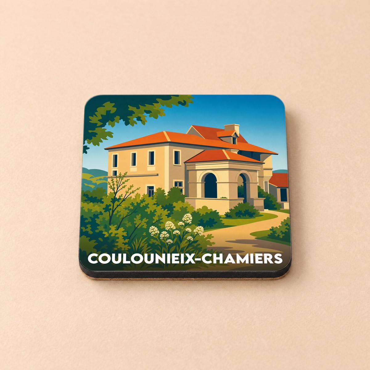 Dessous de verre souvenir de la ville de Coulounieix-Chamiers avec une illustration stylisée d'une maison de maître.