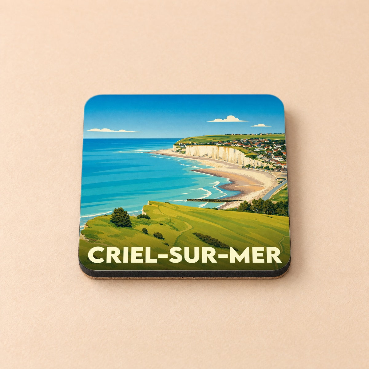 Dessous de verre souvenir de la ville de Criel-sur-Mer illustré par un paysage côtier stylisé.