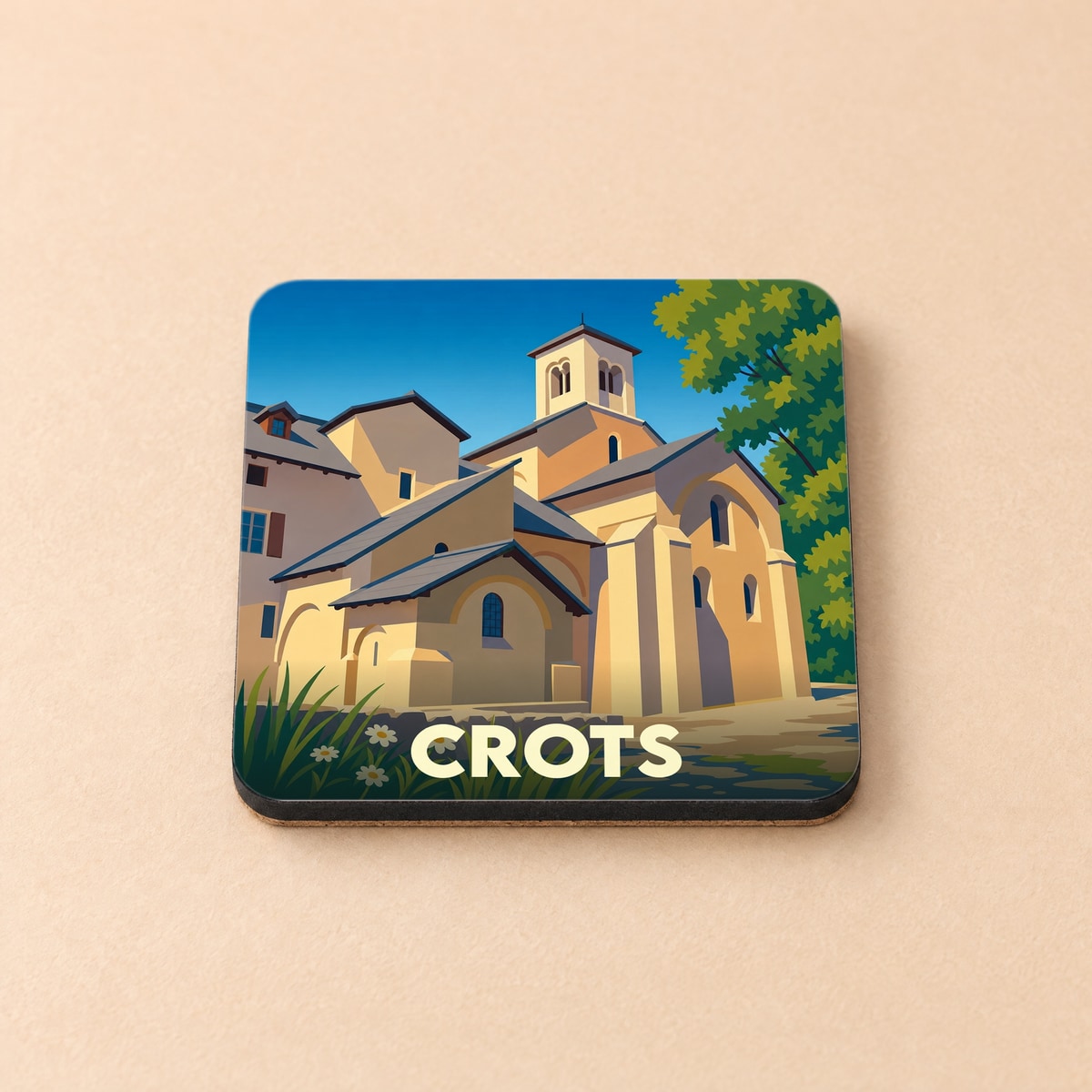 Dessous de verre souvenir de la ville de Crots avec une illustration stylisée de son église.