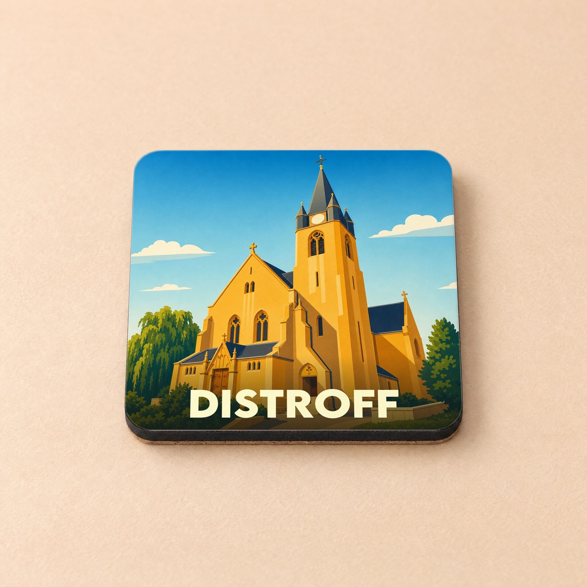 Dessous de verre souvenir de la ville de Distroff avec une illustration stylisée de son église.