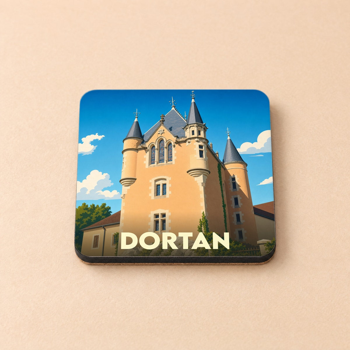 Dessous de verre souvenir de la ville de Dortan avec une illustration stylisée de son château.