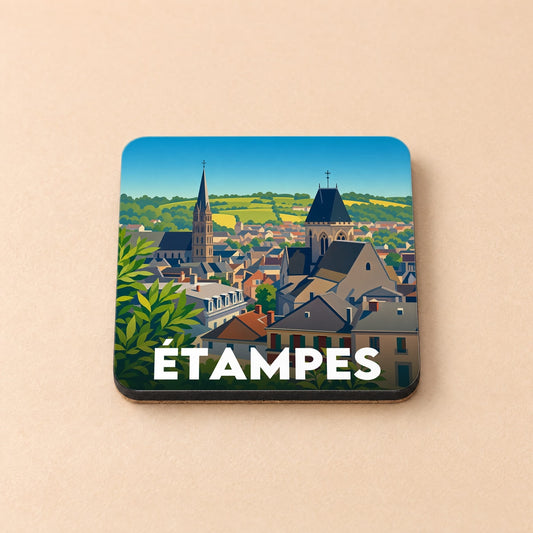Dessous de verre souvenir de la ville d'Étampes avec une illustration stylisée de ses églises et de ses toits.
