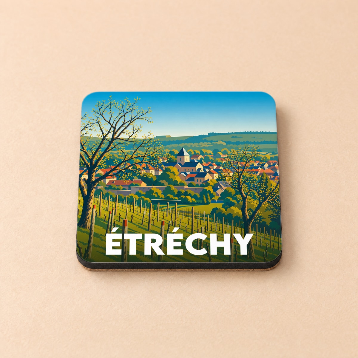 Dessous de verre souvenir de la ville d'Étréchy illustré par un paysage de vignes et de village.