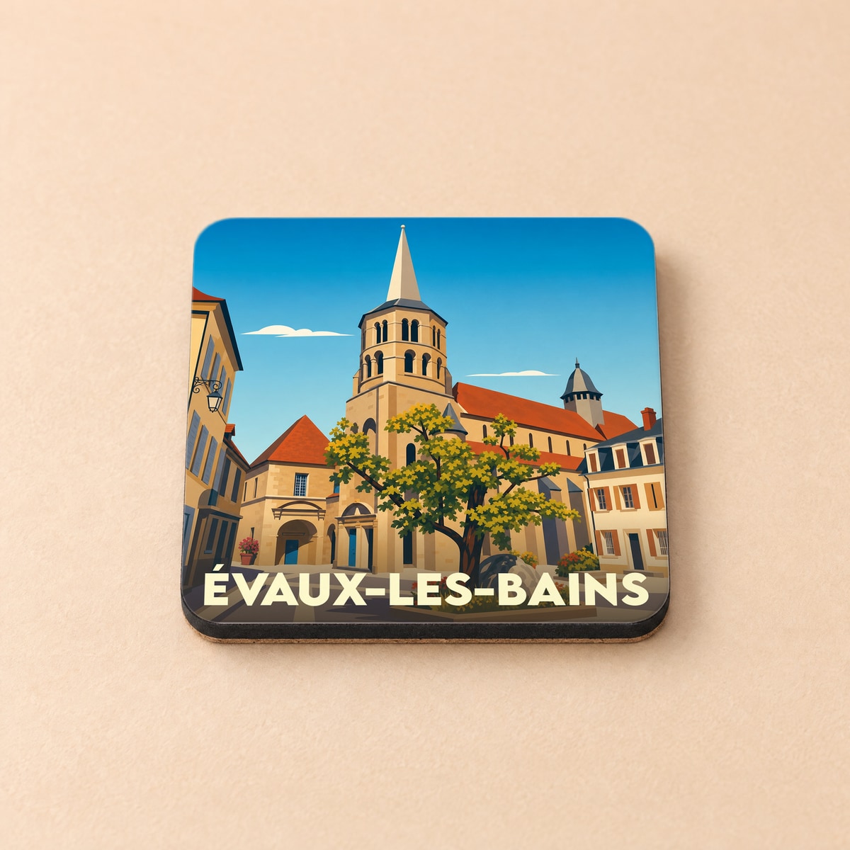 Dessous de verre souvenir de la ville d'Évaux-les-Bains avec une illustration stylisée de son église et de ses maisons.