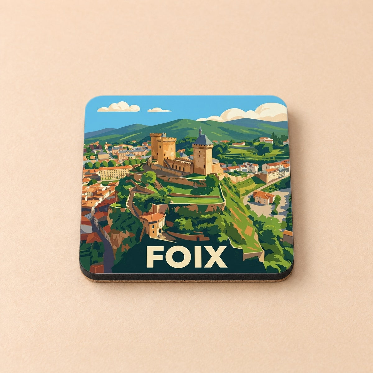 Dessous de verre souvenir de la ville de Foix avec une illustration stylisée du château médiéval.