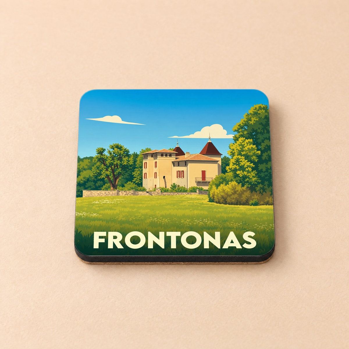 Dessous de verre souvenir de la ville de Frontonas avec une illustration stylisée d'un château.