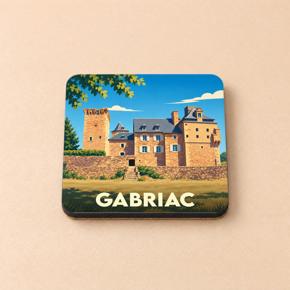 Dessous de verre souvenir de la ville de Gabriac avec une illustration stylisée de son château.