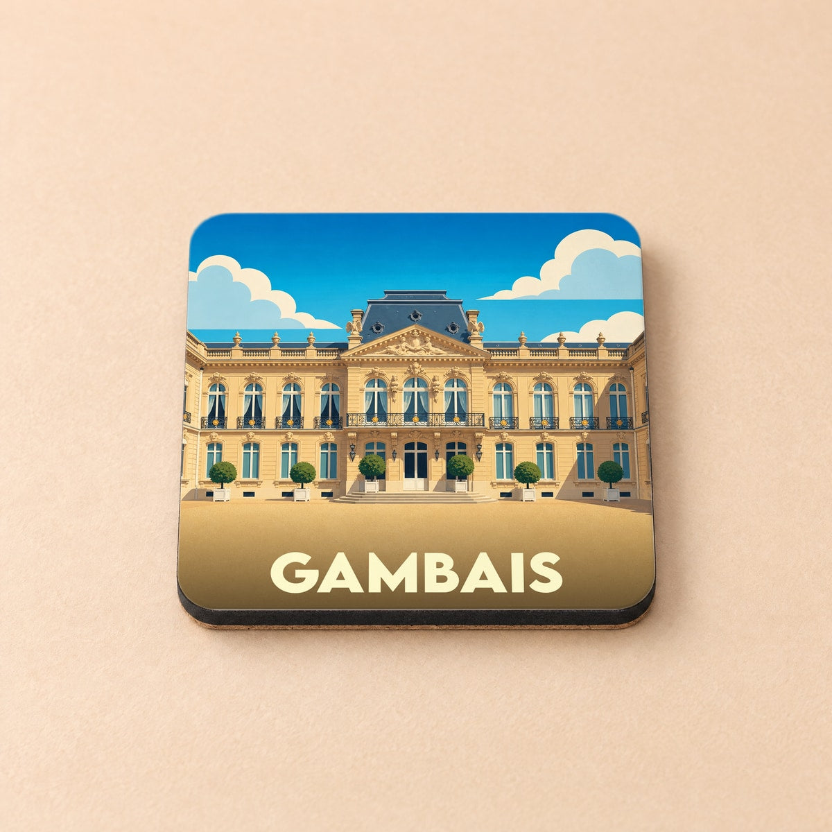 Dessous de verre souvenir de la ville de Gambais illustré d'un château majestueux sous un ciel bleu.